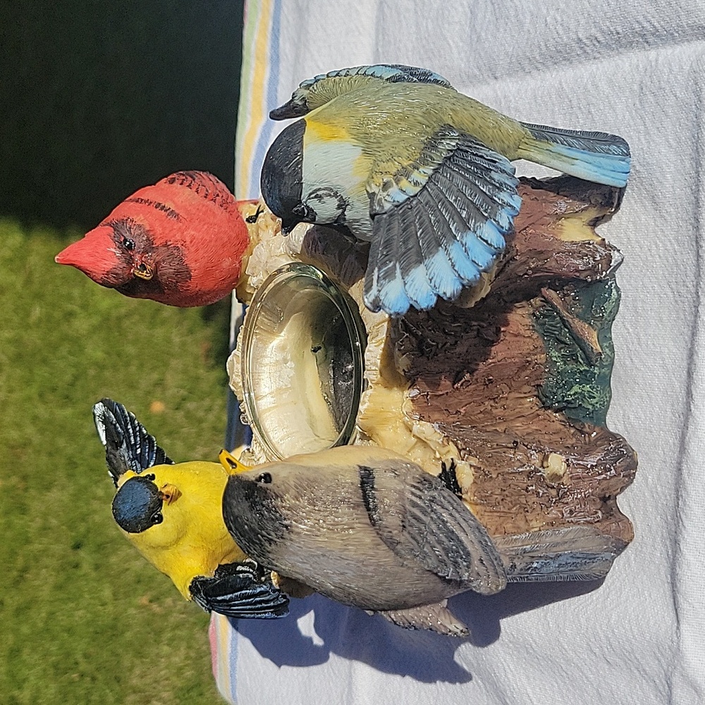 Birds On A Stump With Candle.